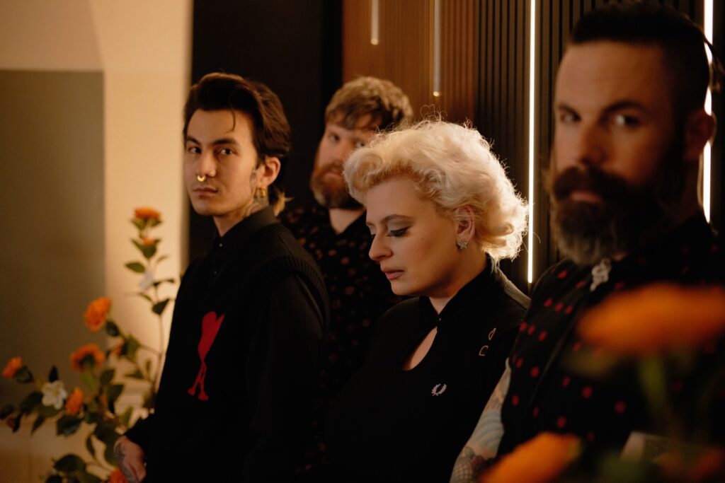 Tess & The Details release new heartbreak anthem and Wes Anderson-inspired music video ‘Standing On the Edge’